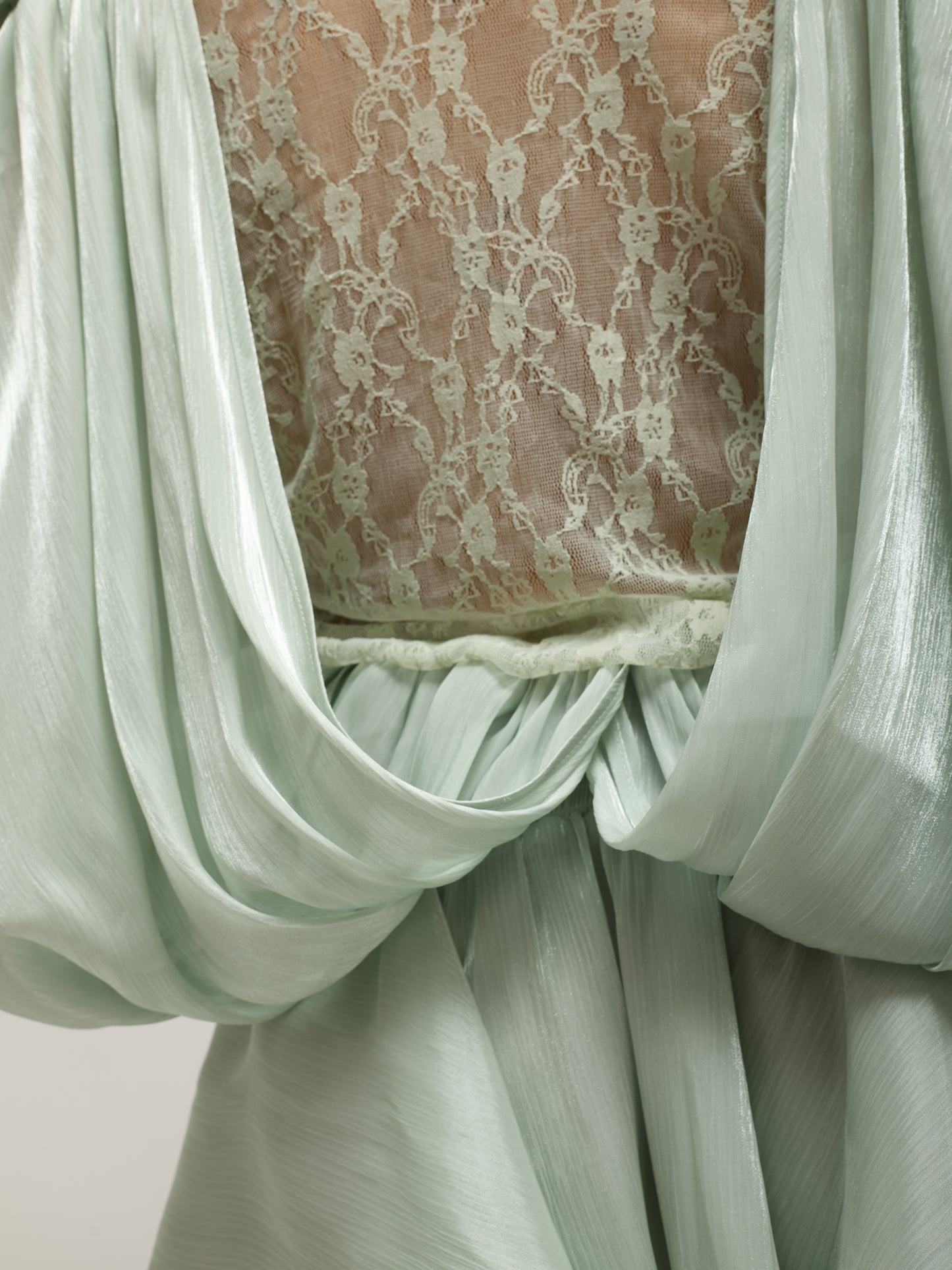 Oversized dress with pastel green lace detail.