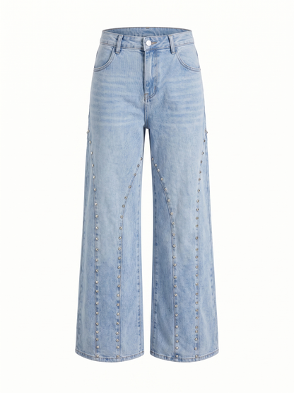 Pantalones vaqueros claros con tachuelas