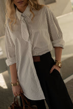 Camisa oversize de rayas con detalle de lazo.