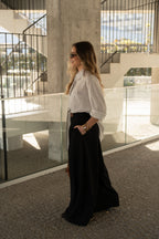 Camisa oversize de rayas con detalle de lazo.