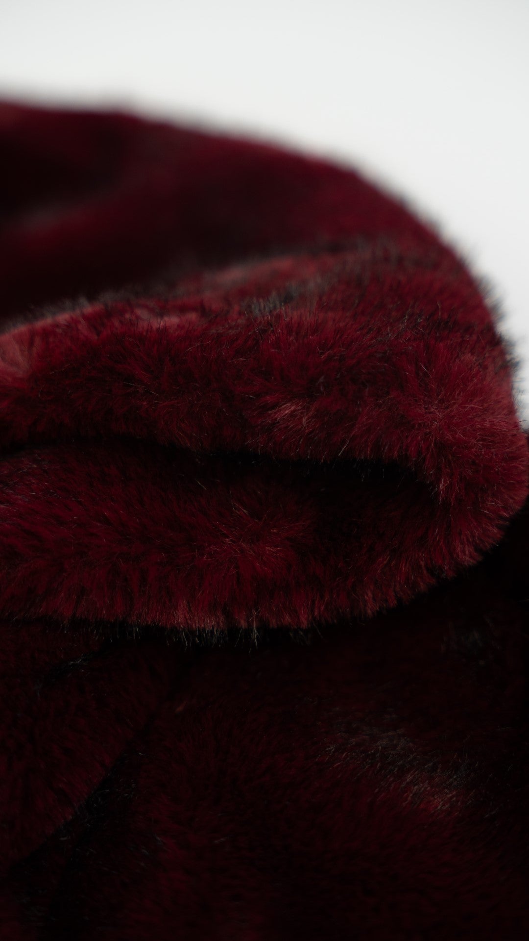 Bordeaux fur coat with hood.