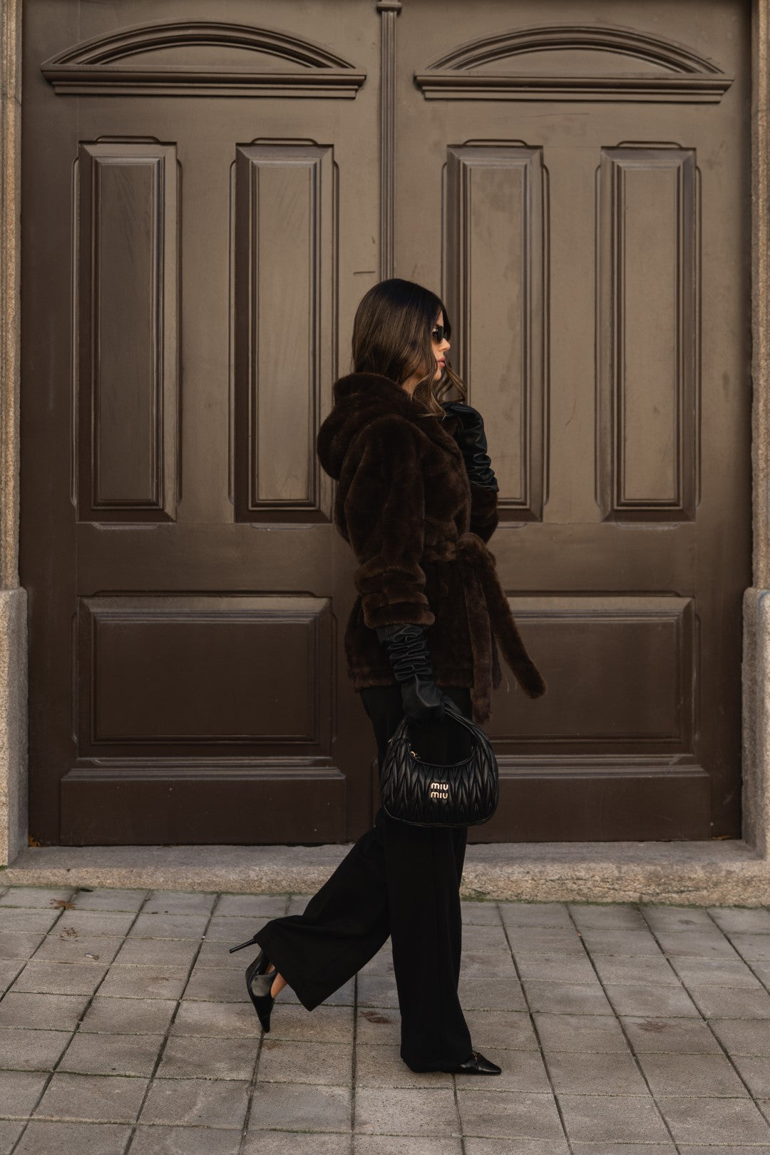 Brown fur coat with hood.