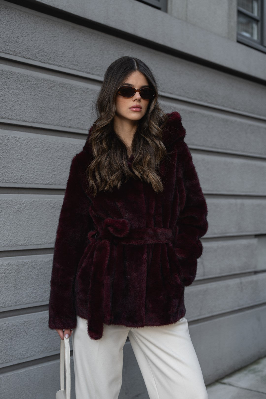 Bordeaux fur coat with hood.