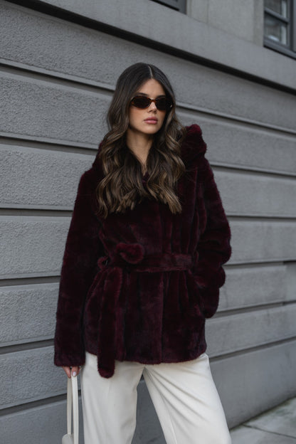 Bordeaux fur coat with hood.