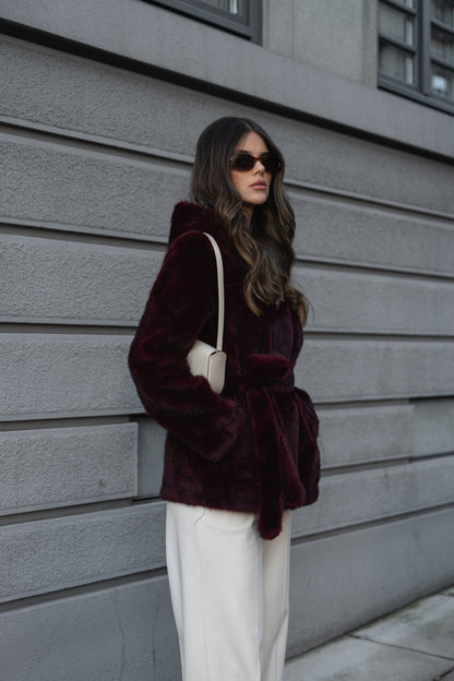 Bordeaux fur coat with hood.