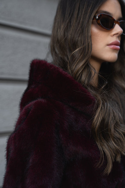 Bordeaux fur coat with hood.