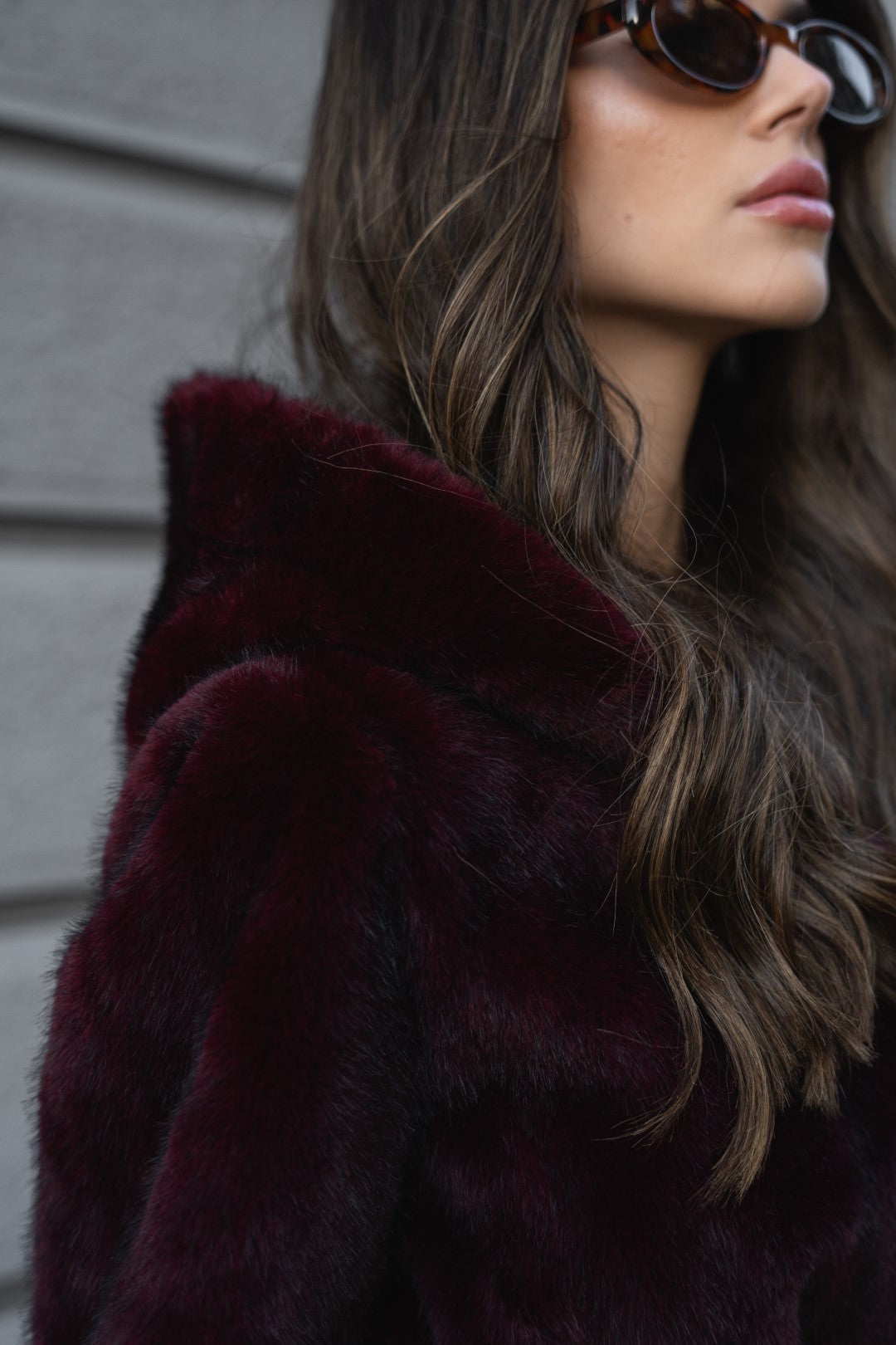Bordeaux fur coat with hood.