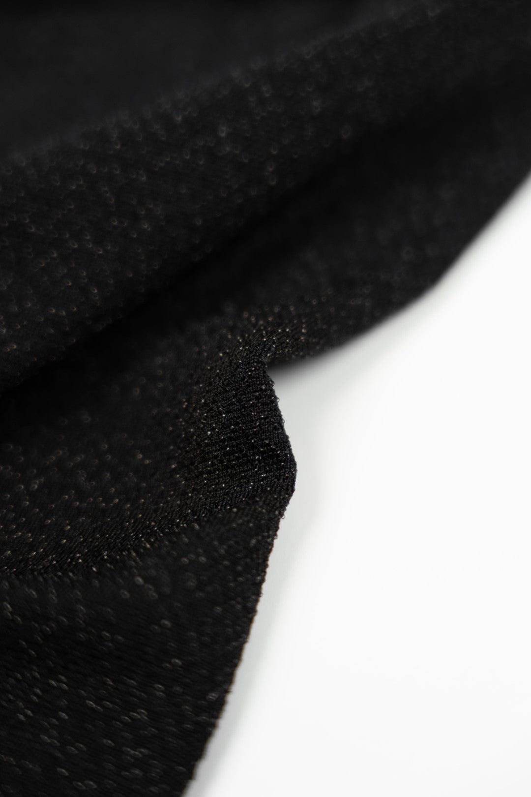 Long black dress with gold choker.