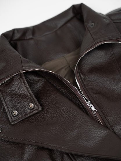 Faux leather jacket with brown collar detail.