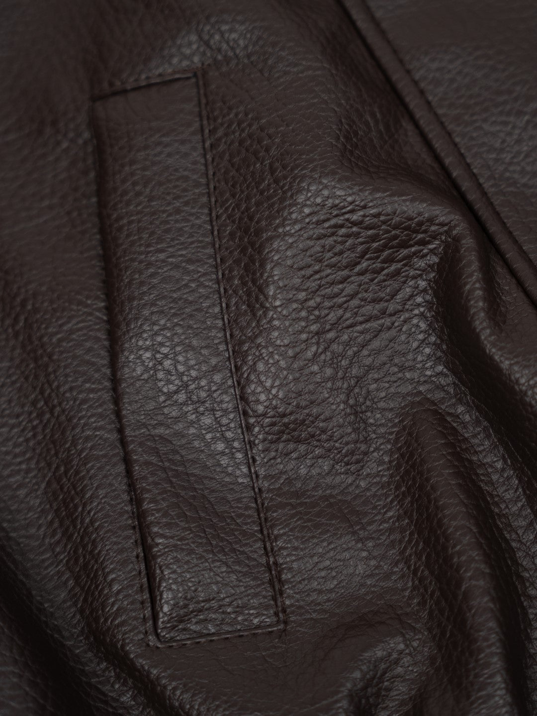 Faux leather jacket with brown collar detail.