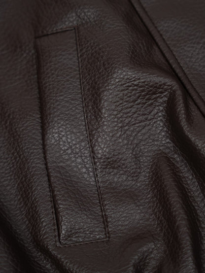 Faux leather jacket with brown collar detail.