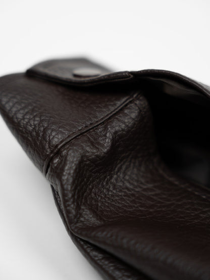 Faux leather jacket with brown collar detail.