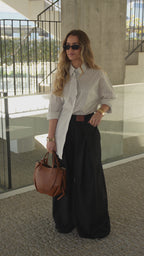 Camisa oversize de rayas con detalle de lazo.